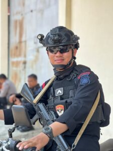 Portrait of an Armed Policeman of Indonesian Mobile Brigade Corps